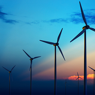 windmills against background of blue sky in the night